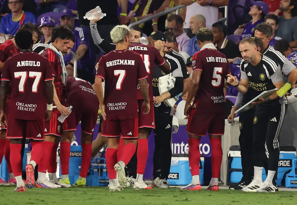 Orlando head coach Martin Perelman, right, coaches players during the...