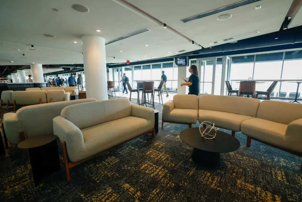 Couches and tables scatter the indoor lounge at the Roth...
