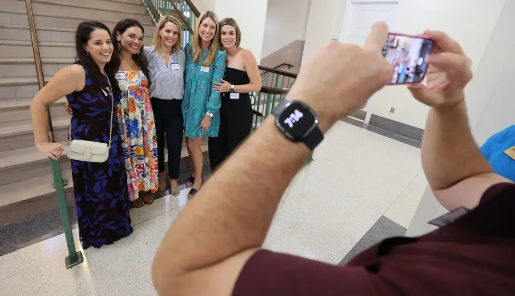Former and current Orlando Sentinel journalists and employees are pictured...