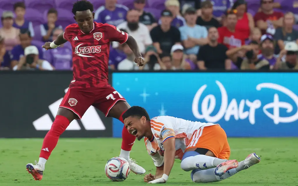 FC Cincinnati player Evander takes a spill in front of...