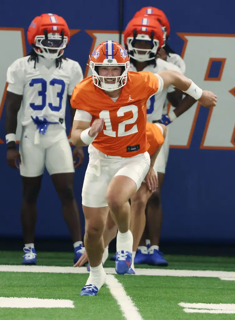 University of Florida quarterback Aaron Philo (12) runs during the...