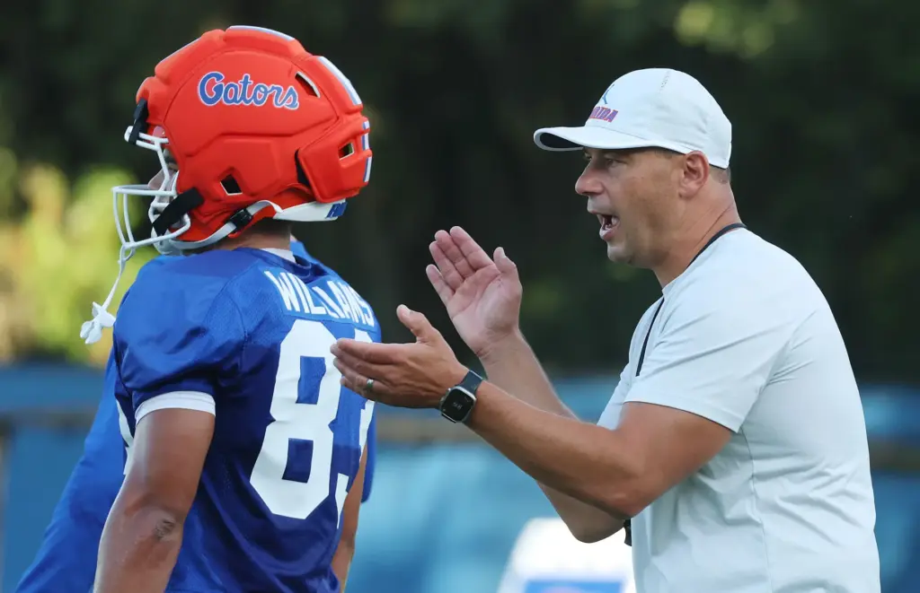 University of Florida head coach Jon Sumrall, right, instructs players...