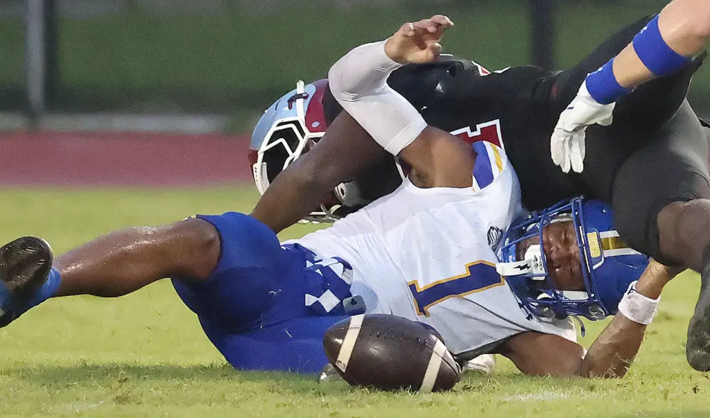 TFA receiver Jaiziah Battle (1) loses the ball as he...