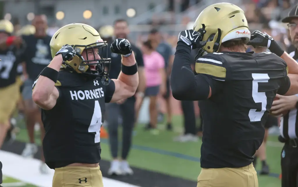Bishop Moore receivers Matthew Sullivan (4) and Magnus Talma (5)...