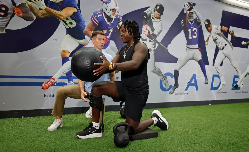 Former FSU linebacker Ethan Pritchard works out with physical therapist...