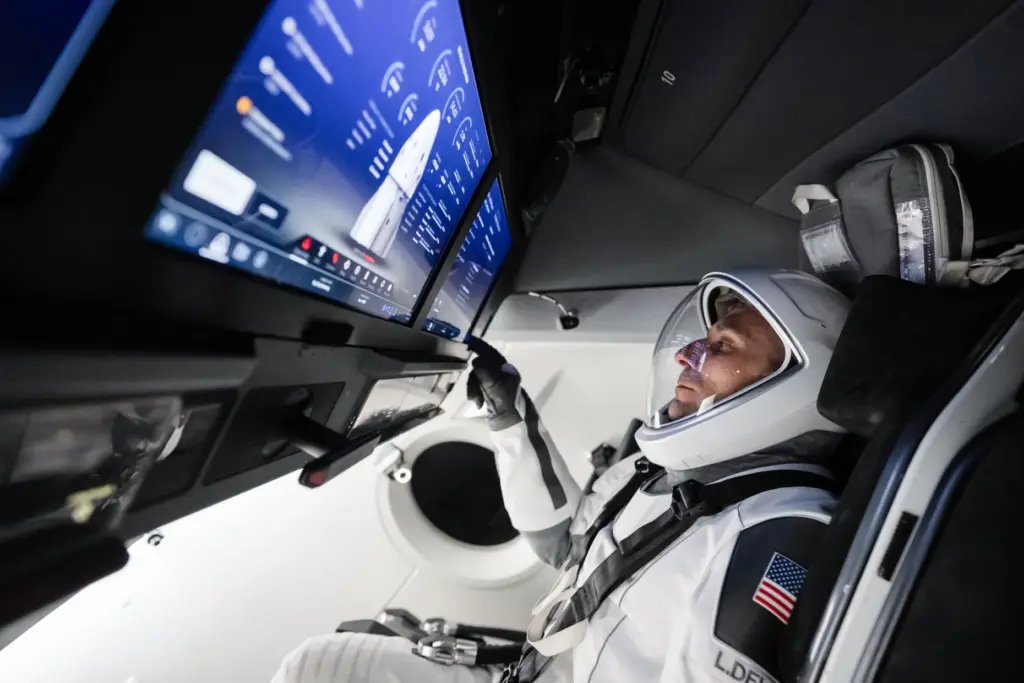 NASA astronaut and SpaceX Crewâ13 pilot Lukeâ¯Delaney sits inside a...