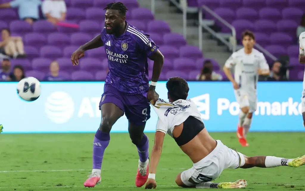 Orlando player Daryl Dike (9) pulls down Atletico player Miguel...