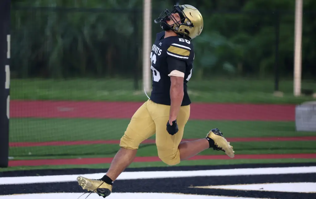 Bishop Moore running back Donovan Ferrufino celebrates after a touchdown...