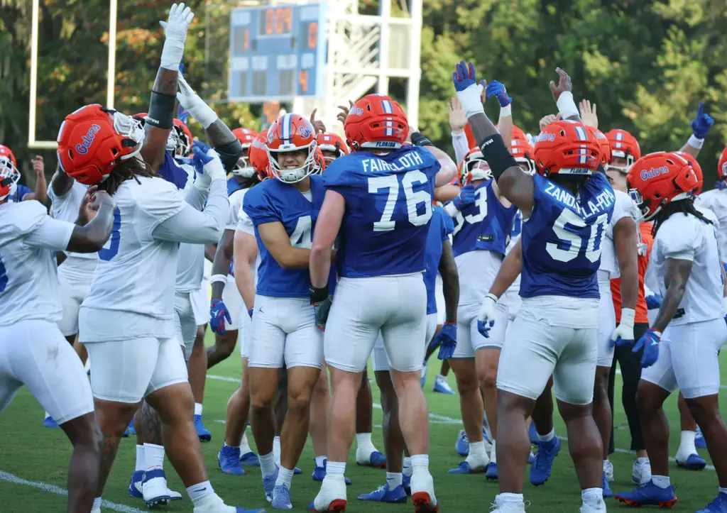 University of Florida players cheer during the Gators football camp...