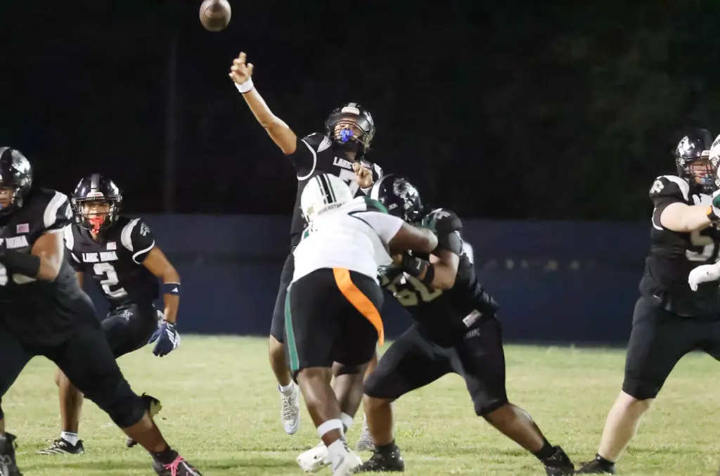 Lake Nona quarterback Eli Nickerson (7) throws during the Evans...