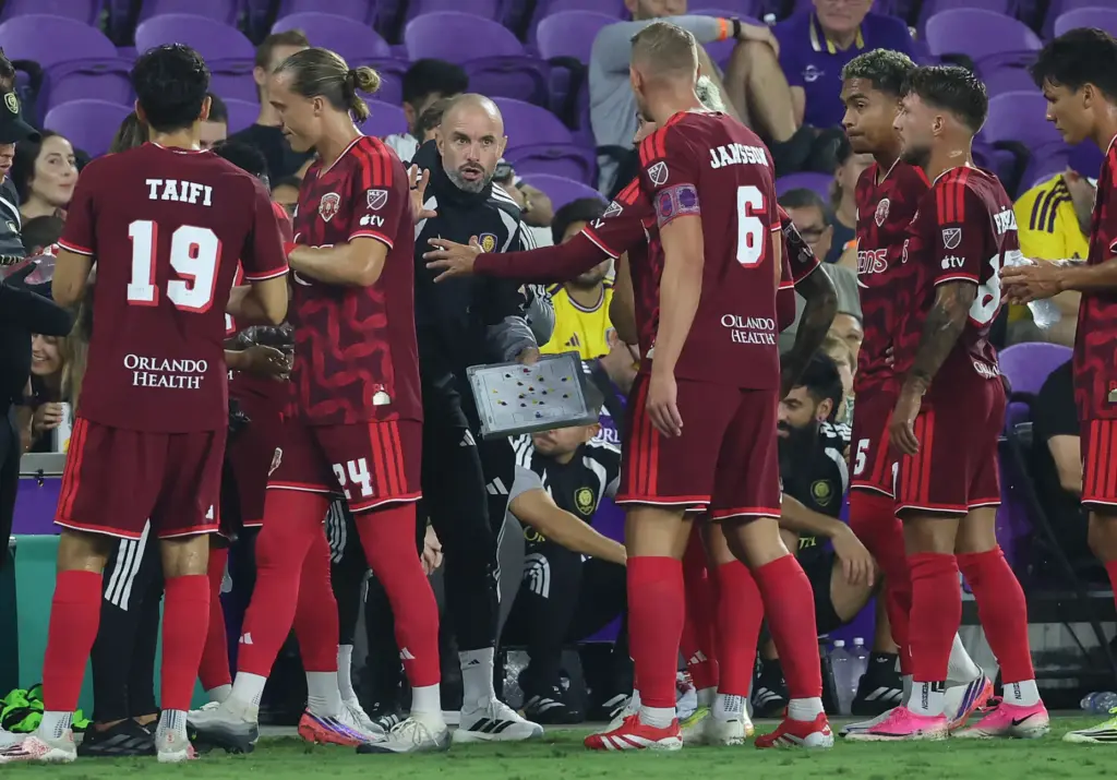 Orlando coach Martin Perelman coaches players during the Chicago Fire...