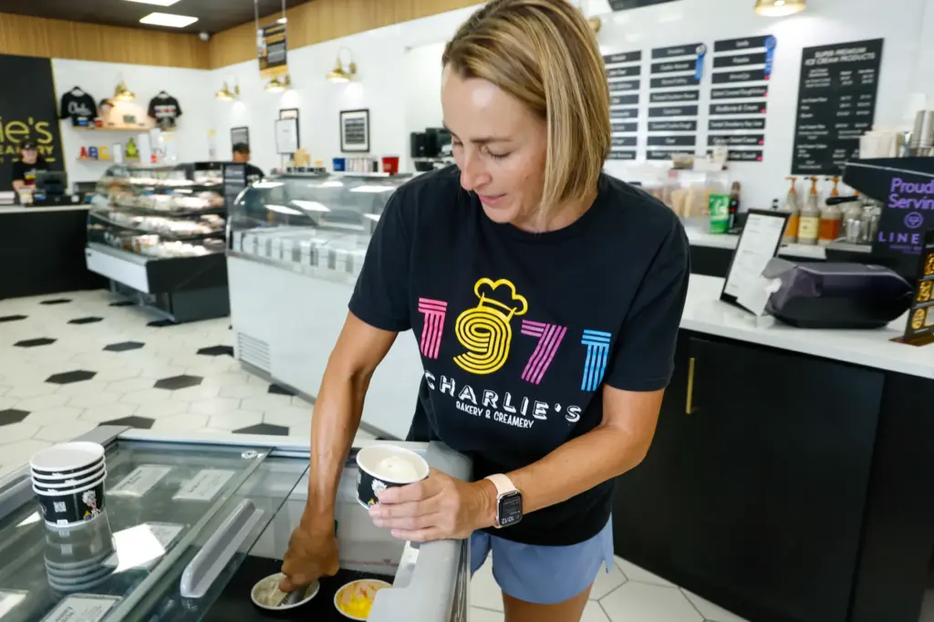Charlieâs Bakery & Creamery owner Tricia Hage scoops a cup...