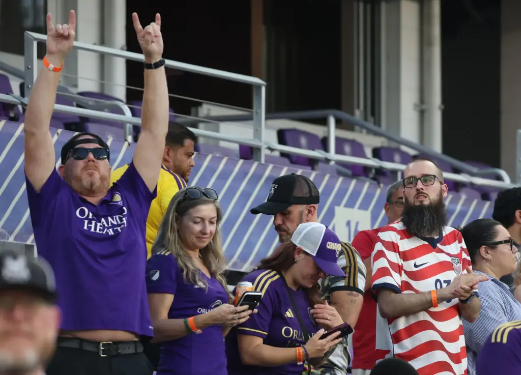 Orlando fans cheer during the Chicago Fire Football Club at...