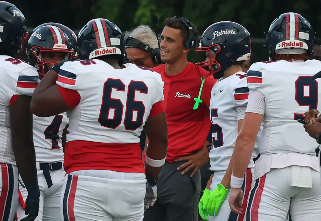 Lake Brantley coach Garrett Kruczek coaches players during the Lake...