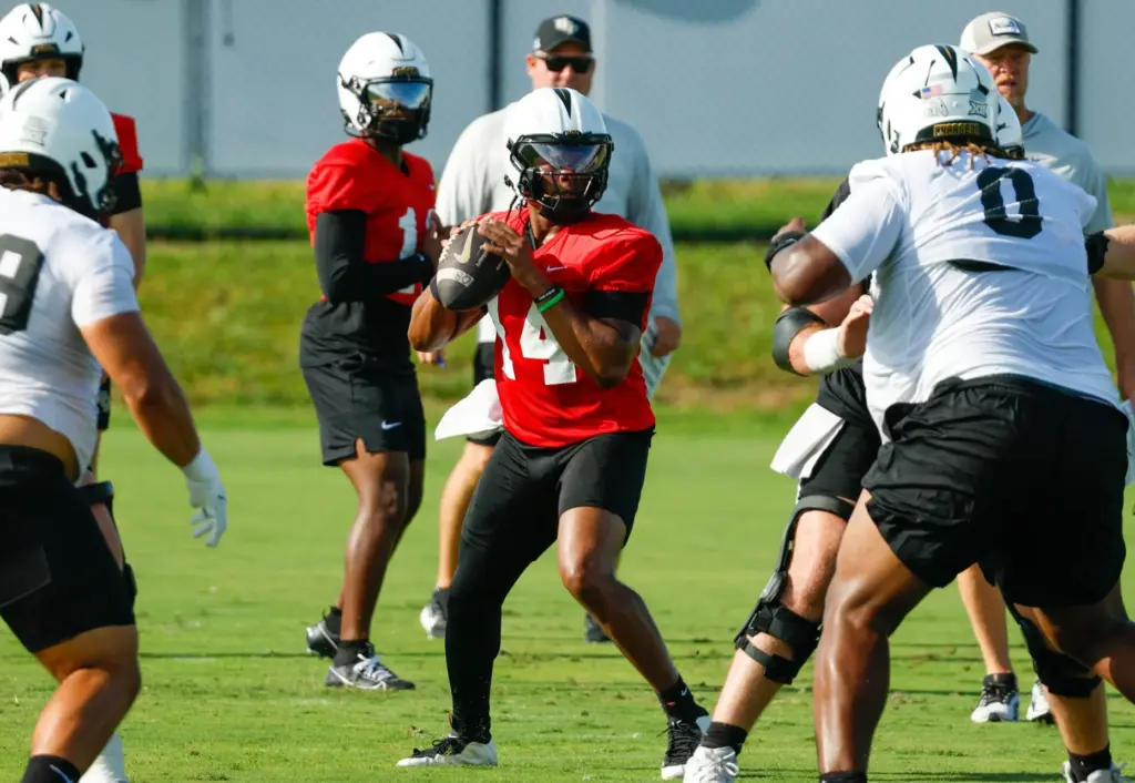 UCF Knights quarterback Alonza Barnett III (#14) runs through drills...