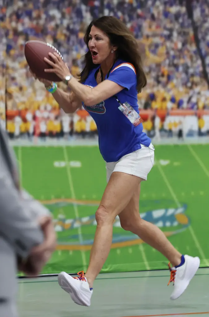 Florida fan Victoria Peurrung catches a pass during the Florida...