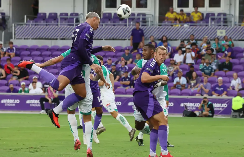 Orlando player Iago (57) heads the ball off a corner...