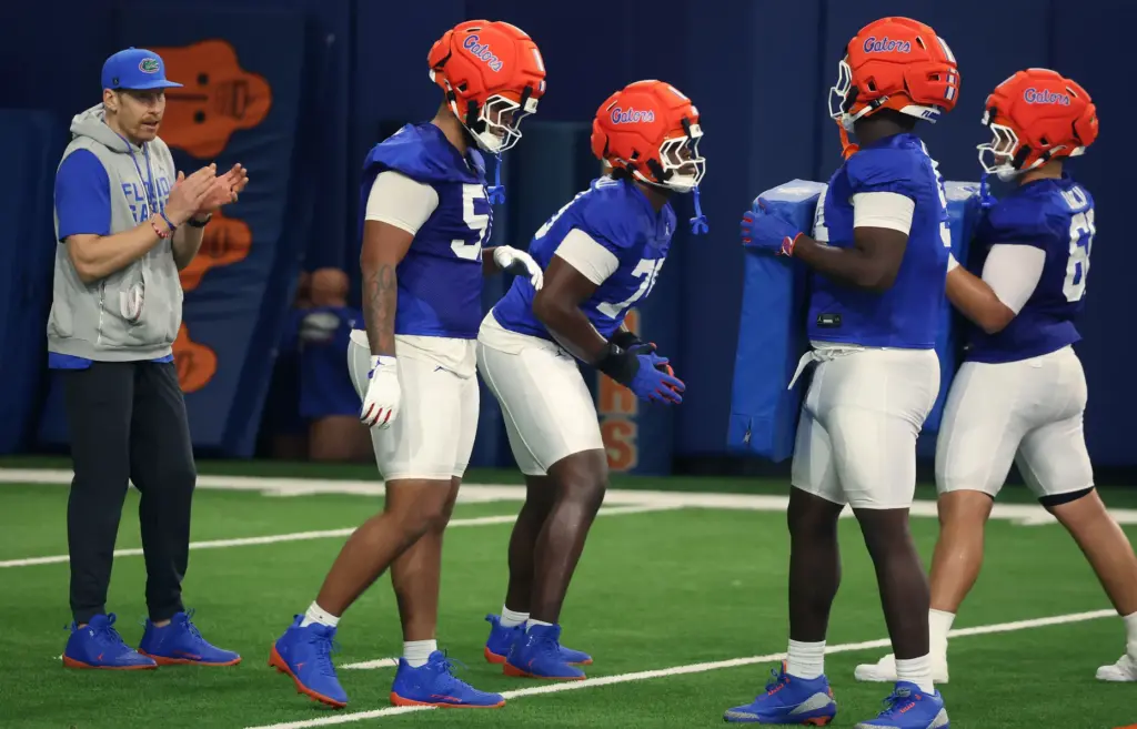 University of Florida offensive line coach Phil Trautwine coaches linemen...