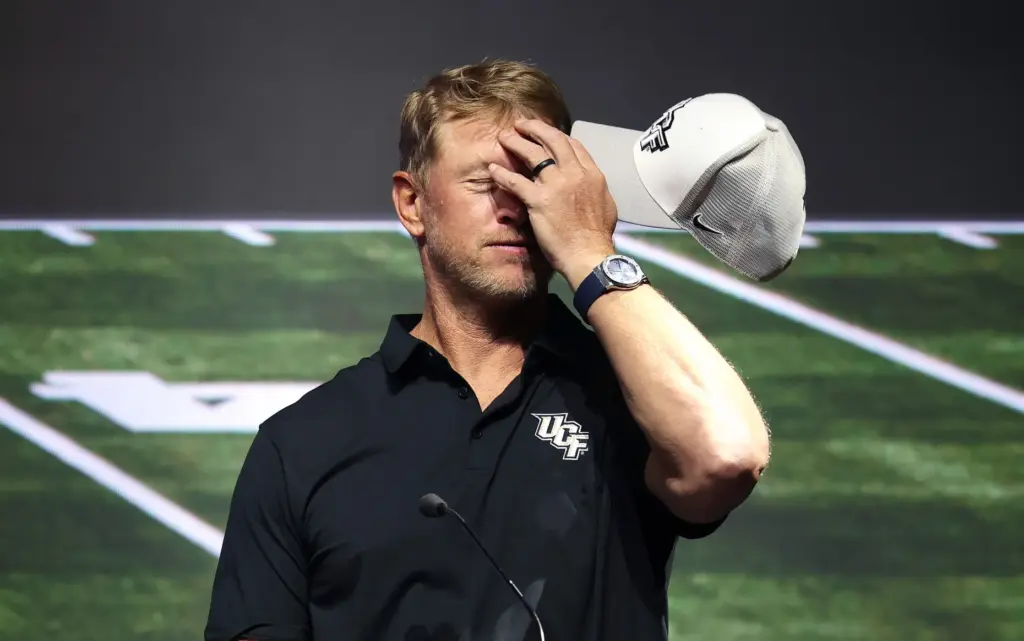University of Central Florida football coach Scott Frost jokes about...