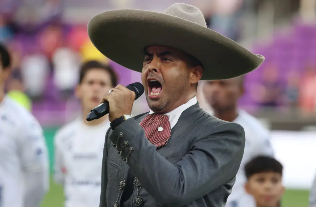 Francisco Gabriel sings the Mexican national anthem before the Club...