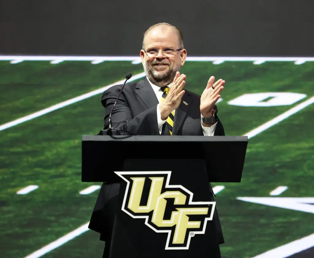 University of Central Florida President Alexander Cartwright applauds during the...