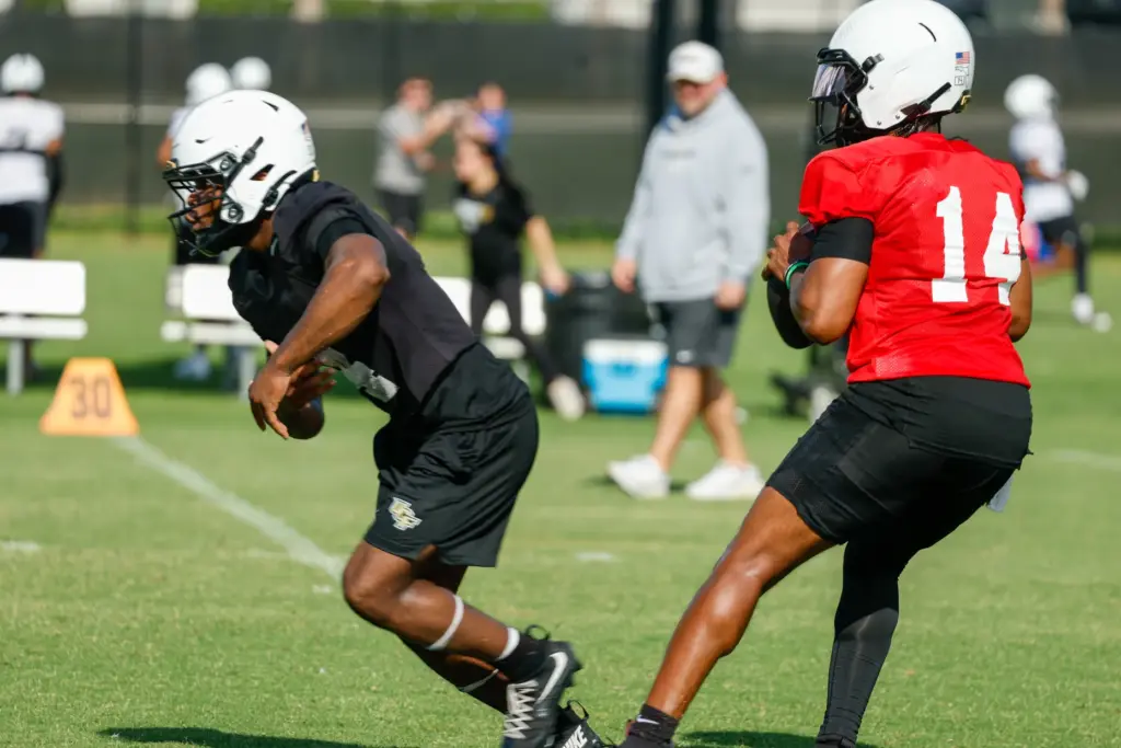UCF Knights quarterback Alonza Barnett III (#14) runs through drills...