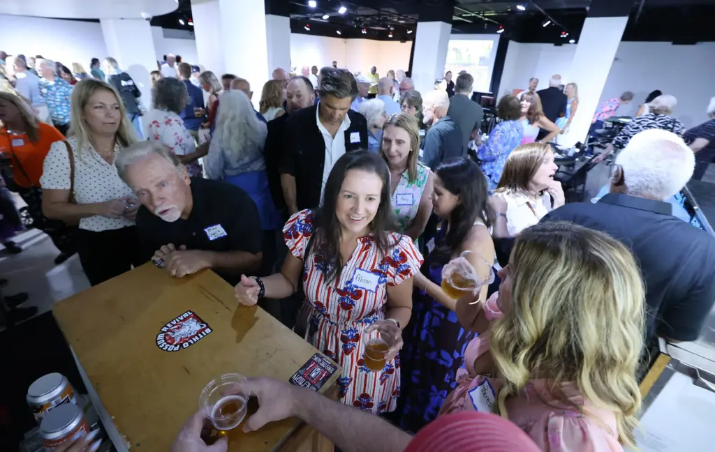 Former and current Orlando Sentinel journalists and employees are pictured...