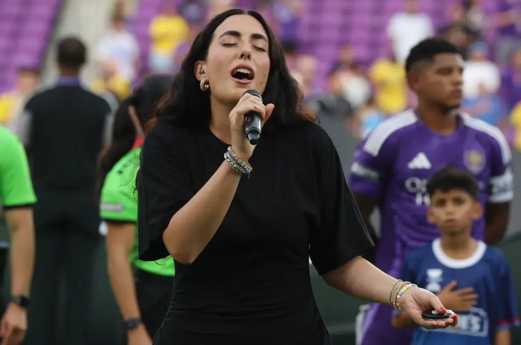 Cassandra DiFruscio sings the United States national anthem before the...