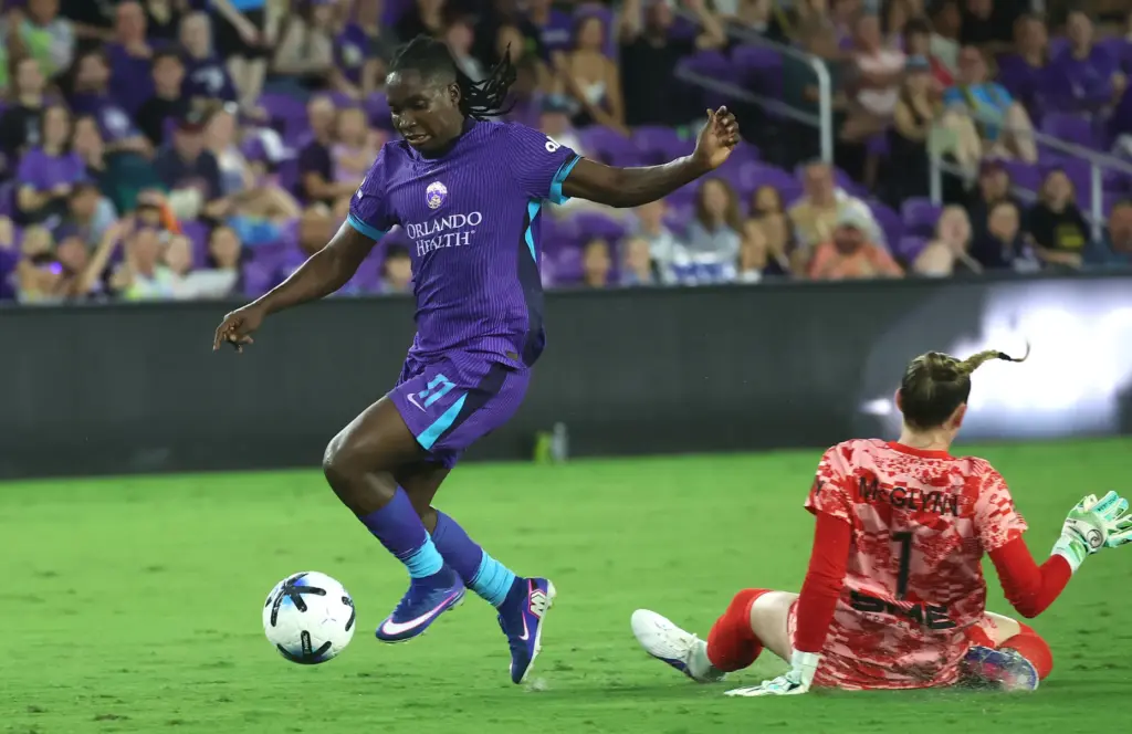 Orlando player Barbra Banda (11) scores a goal past Utah...