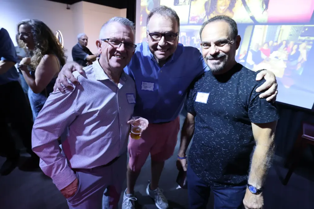 Former and current Orlando Sentinel journalists and employees are pictured...