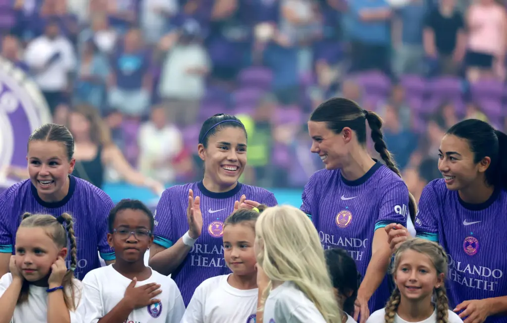 Orlando players smile before the Racing Louisville FC at Orlando...