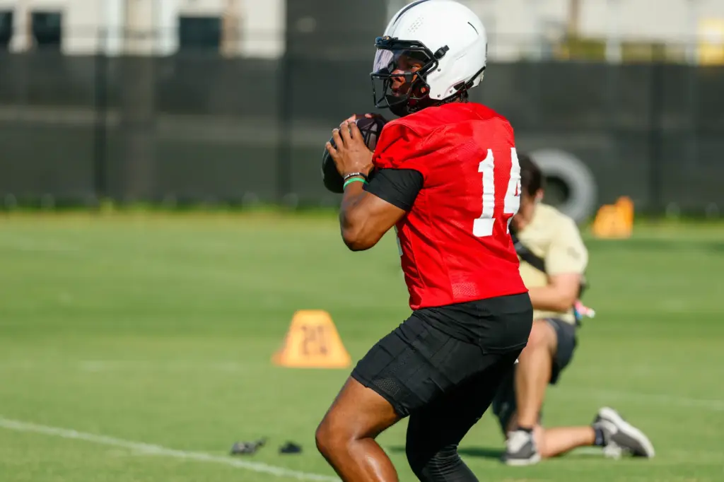 UCF Knights quarterback Alonza Barnett III (#14) runs through drills...