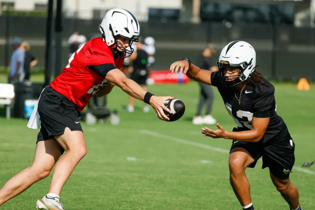 UCF Knights running back Chance Nixion and quarterback Dante Carr...
