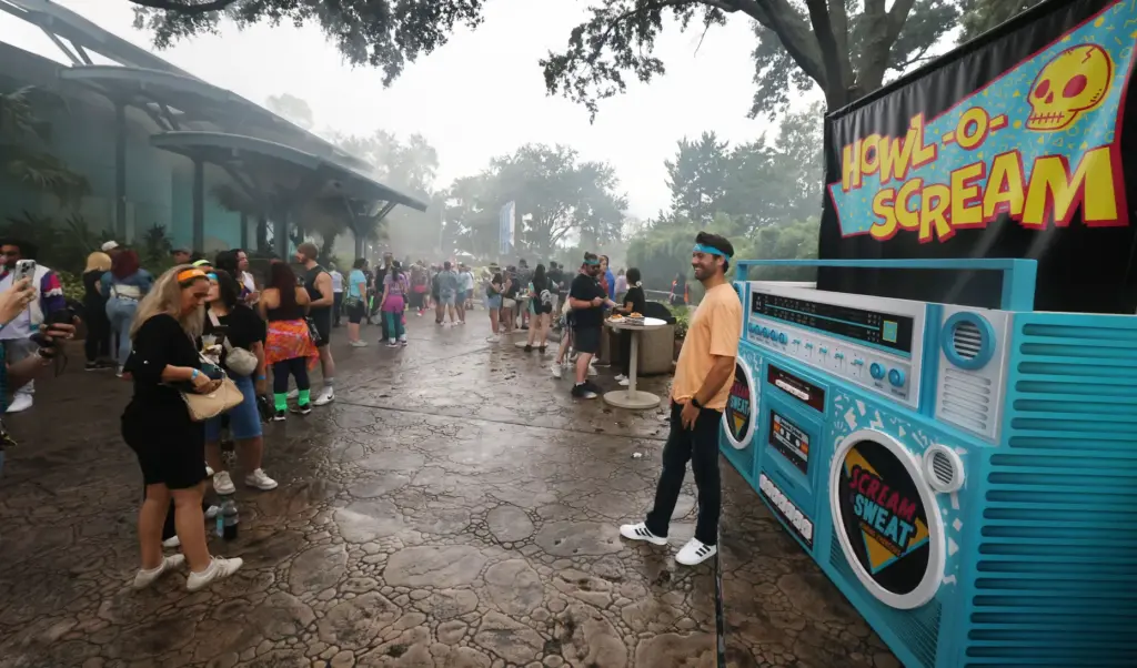 Attendees take photos during Scream & Sweat, an exclusive media...