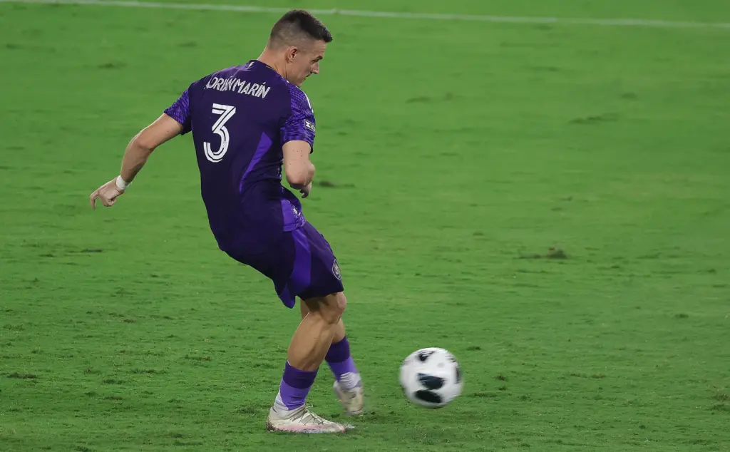 Orlando player Adrian Marin kicks the winning penalty kick during...