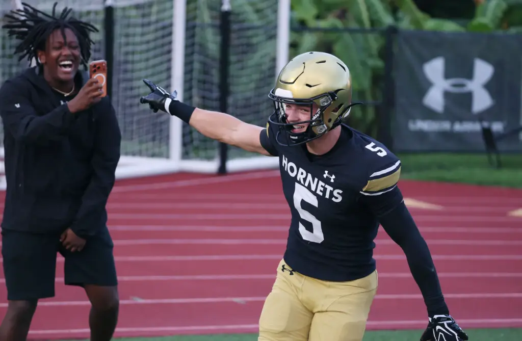 Bishop Moore wide receiver Magnus Talma celebrates after a touchdown...