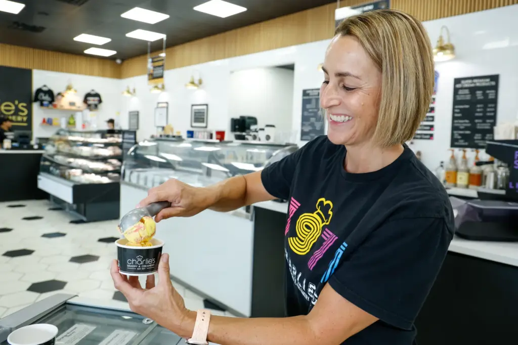 Charlieâs Bakery & Creamery owner Tricia Hage scoops a cup...