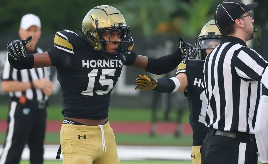 Bishop Moore defensive back Chance Gray gestures after a play...