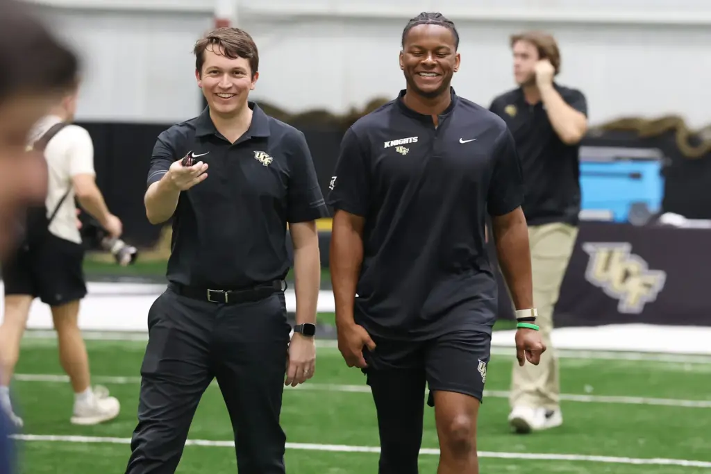 UCF quarterback Alonza Barnett III (right) smlies as he walks...