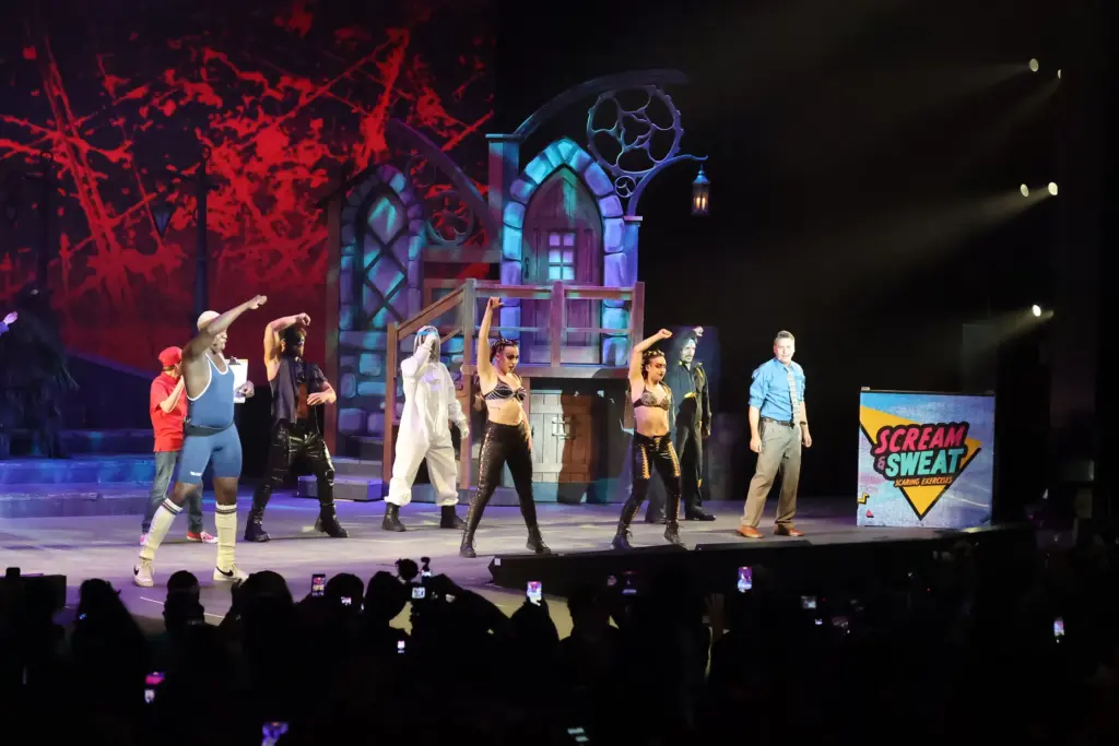 Characters perform on stage during Scream & Sweat, an exclusive...