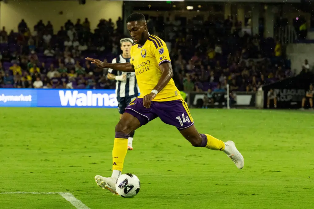 Orlando City player Tyrese Spicer (14) makes an assist during...