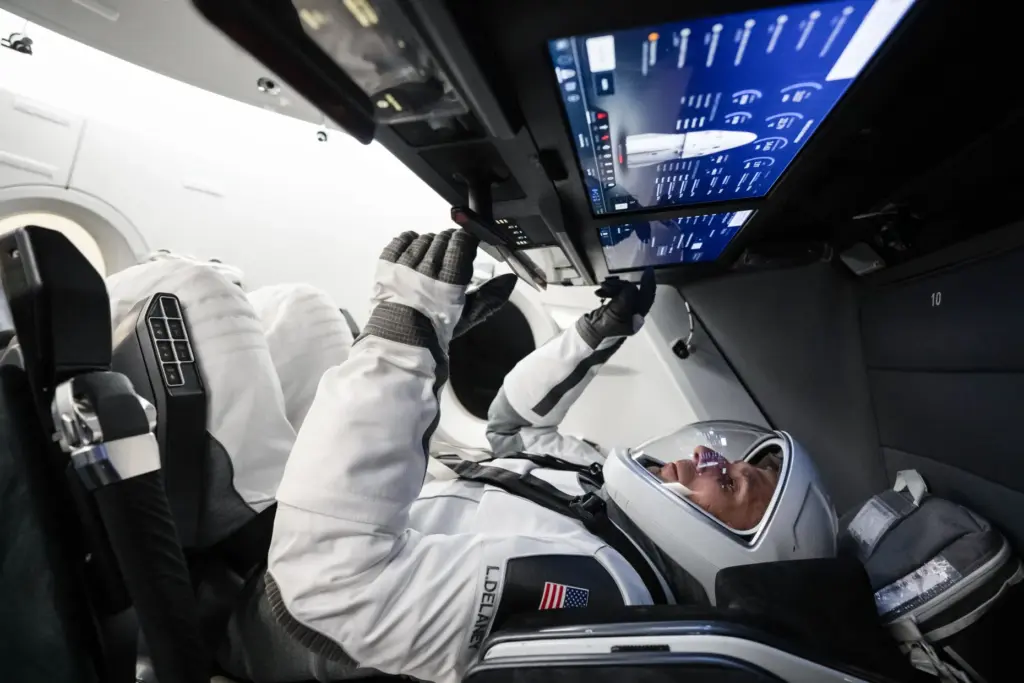 NASA astronaut and SpaceX Crewâ13 pilot Lukeâ¯Delaney sits inside a...