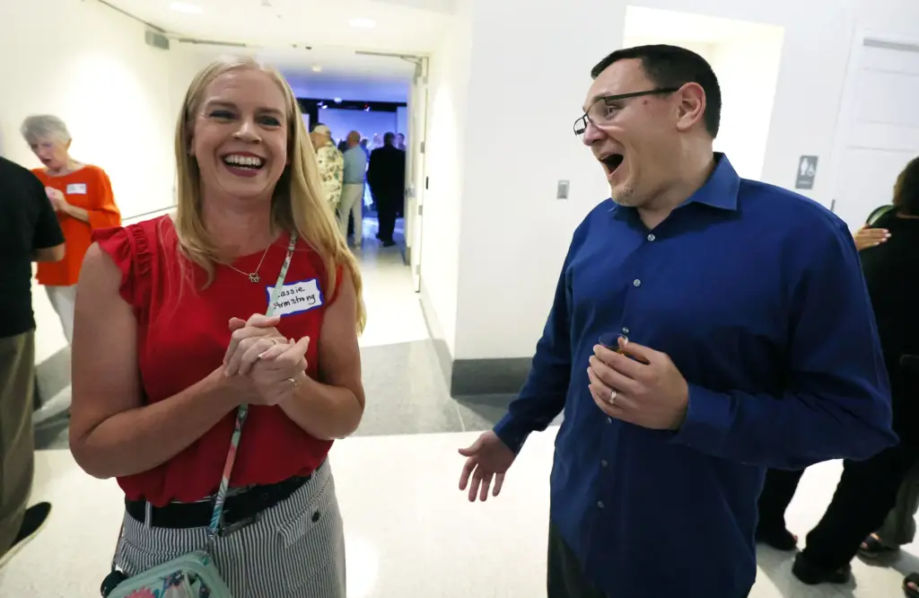 Former and current Orlando Sentinel journalists and employees are pictured...
