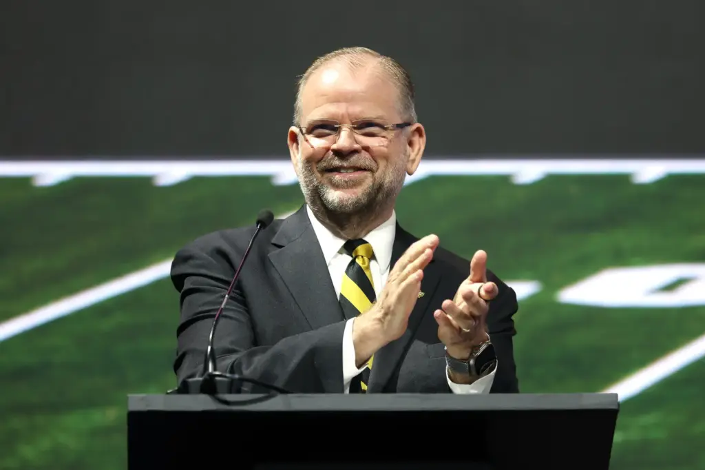 University of Central Florida President Alexander Cartwright applauds during the...
