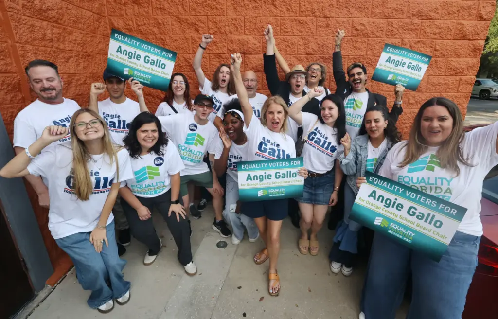 Angie Gallo, middle, cheers with supporters during her election party...