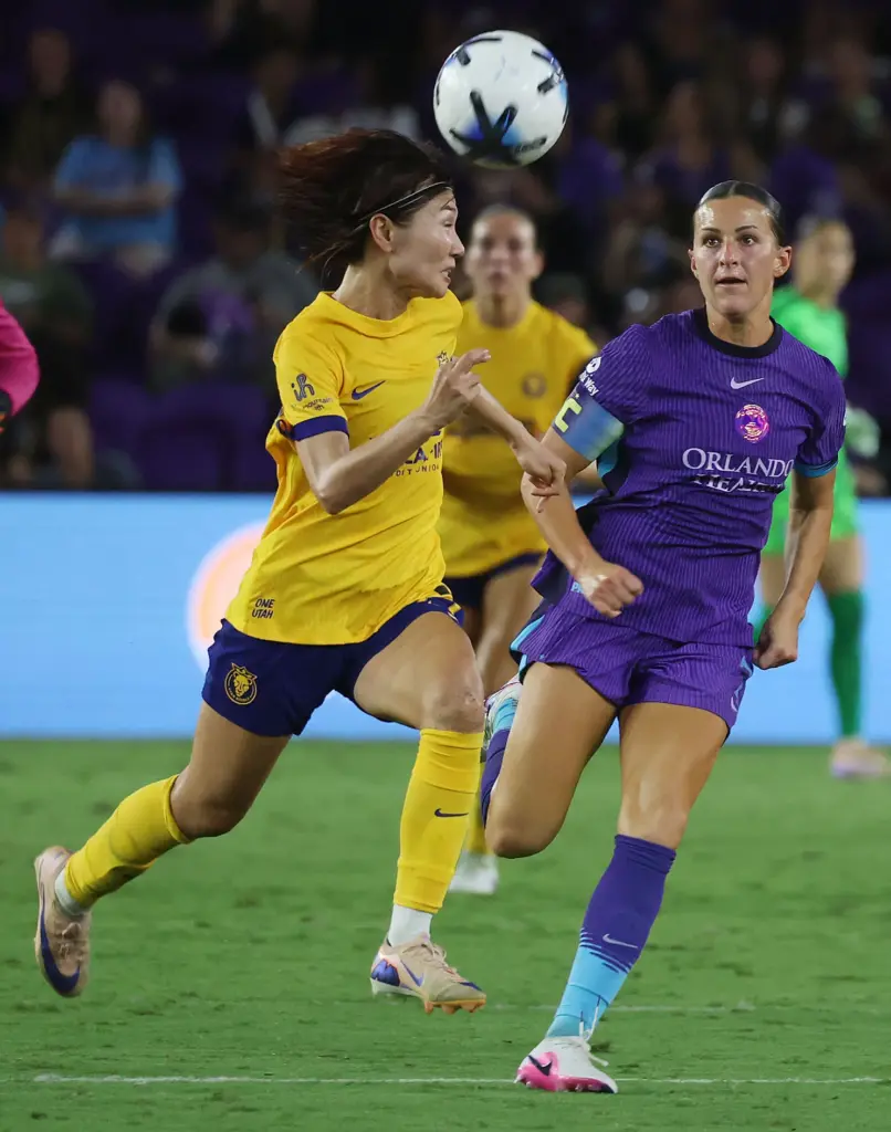Utah player Miyabi Moriya (left) and Orlando player Haley McCutcheon...