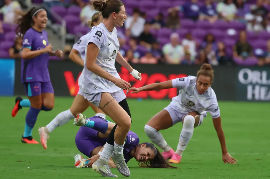 Orlando player Jacquie Ovalle (bottom) falls during the Racing Louisville...