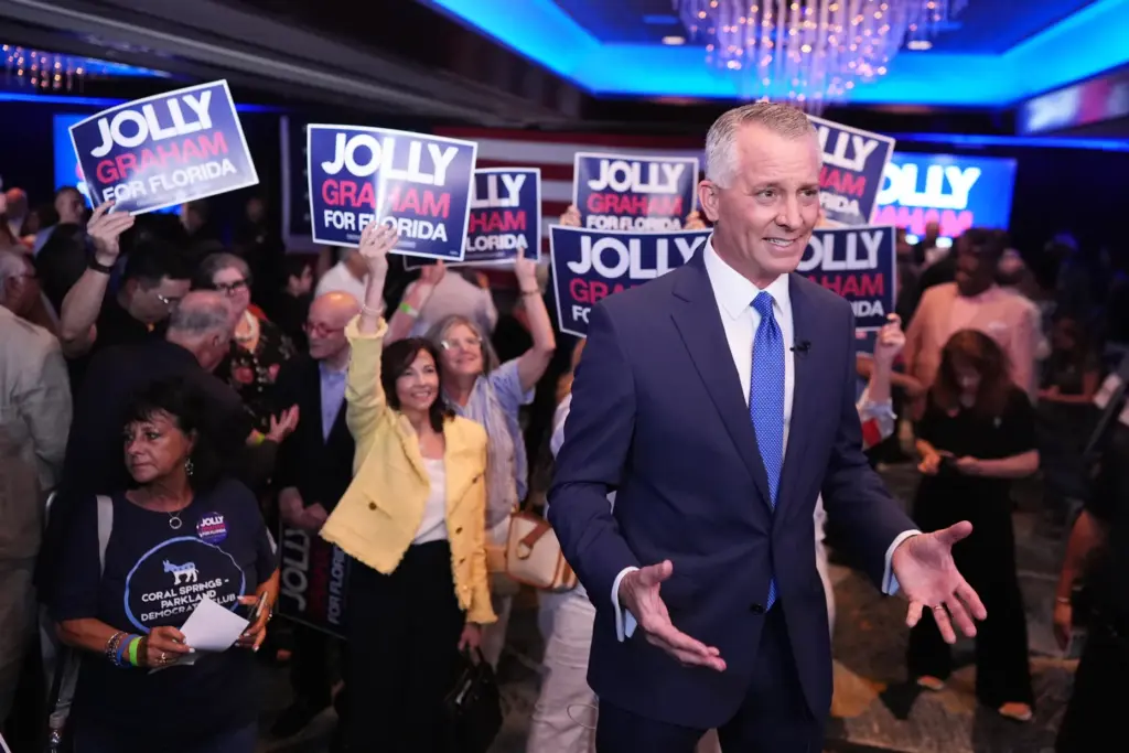 Florida Democratic gubernatorial candidate David Jolly speaks in front of...