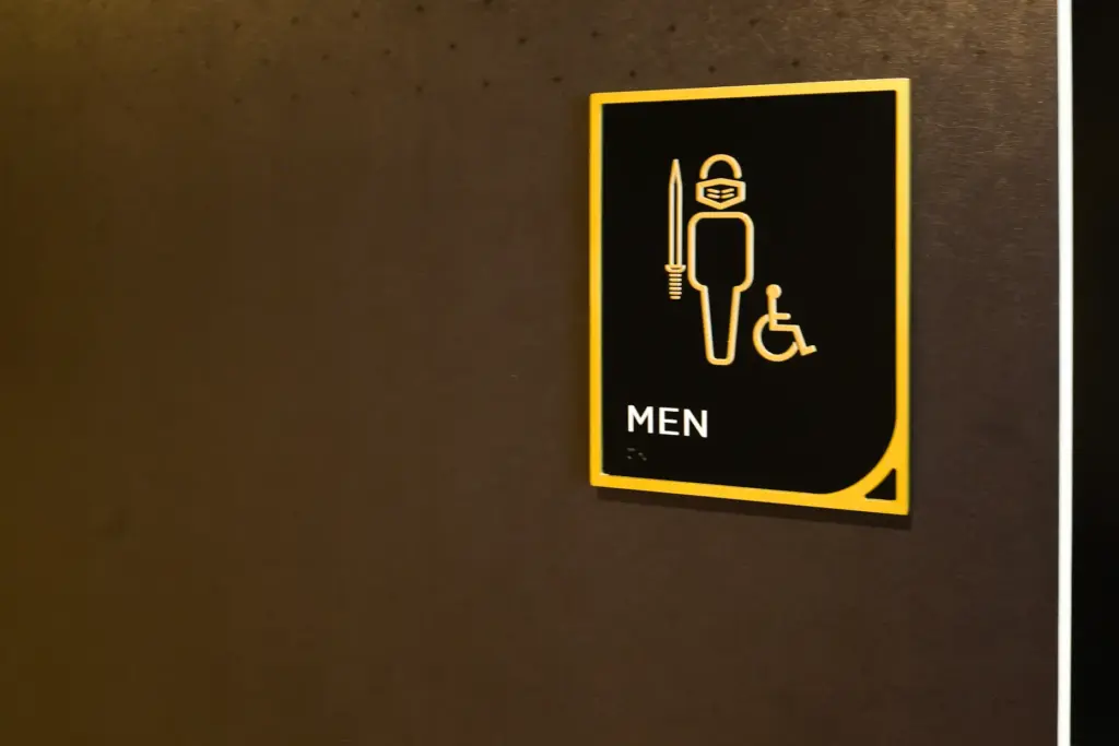 A knight-themed detail for the restroom signage at the Roth...