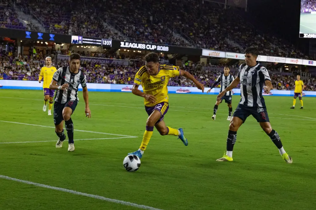 Orlando City player Justin Ellis (22) sprints to keep the...